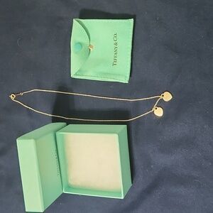 Tiffany and Co. Silver Pendants and charm.